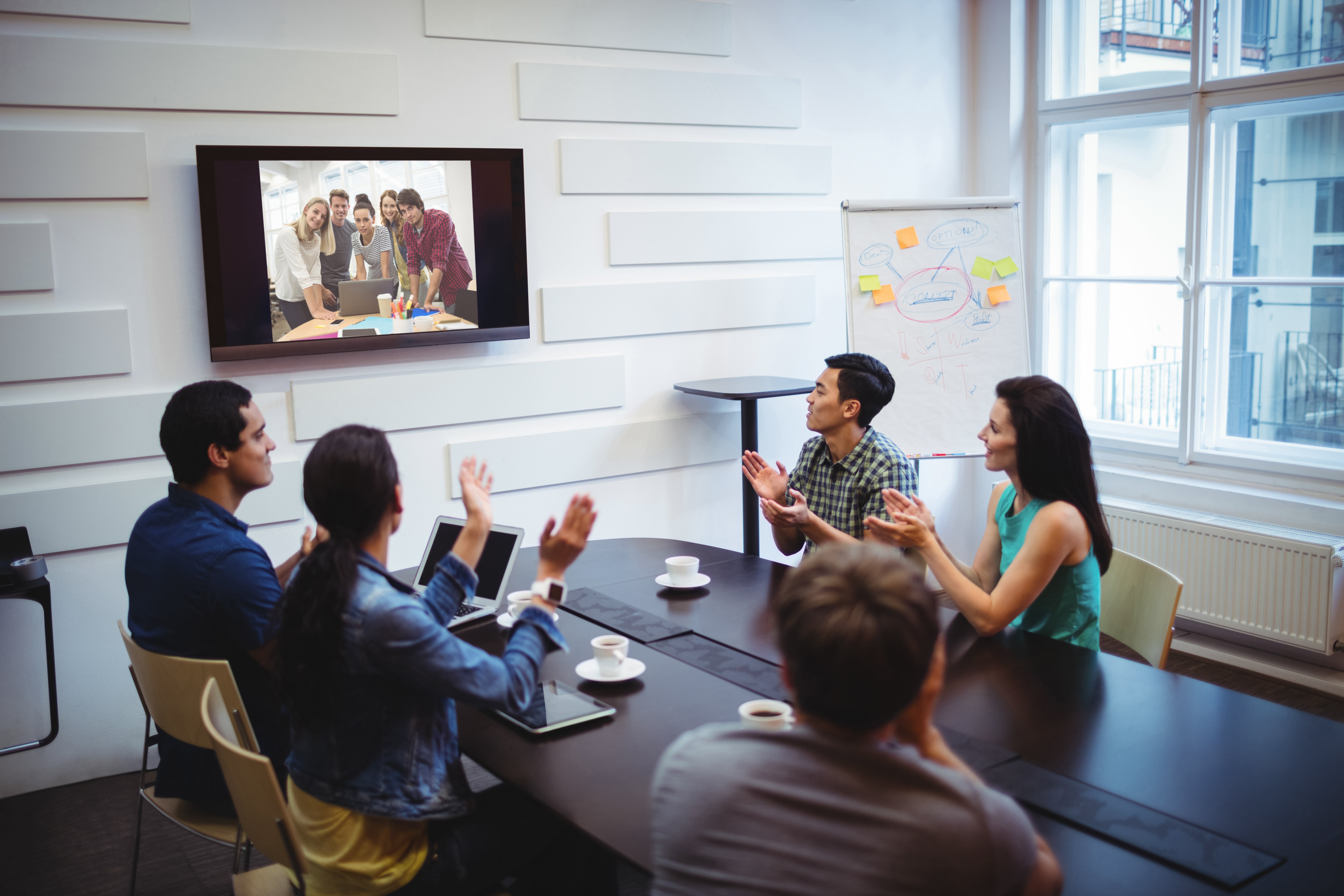 business-executive-applauding-during-video-conference